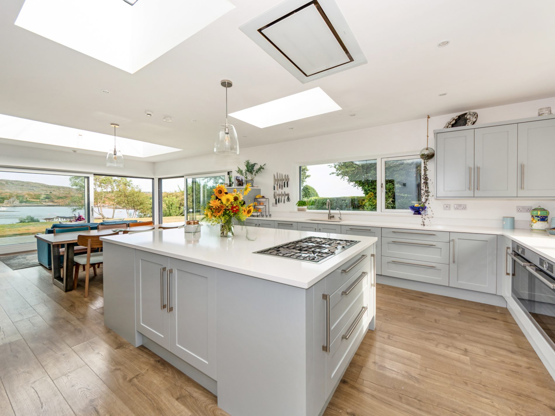 Kitchen and dining space under skylights