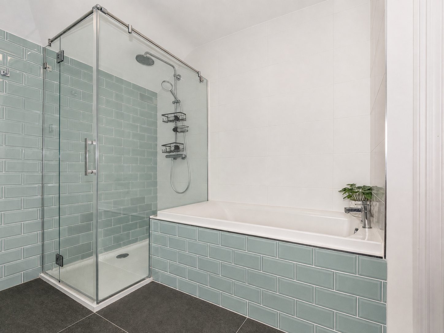 Bathroom with glass shower enclosure and bath