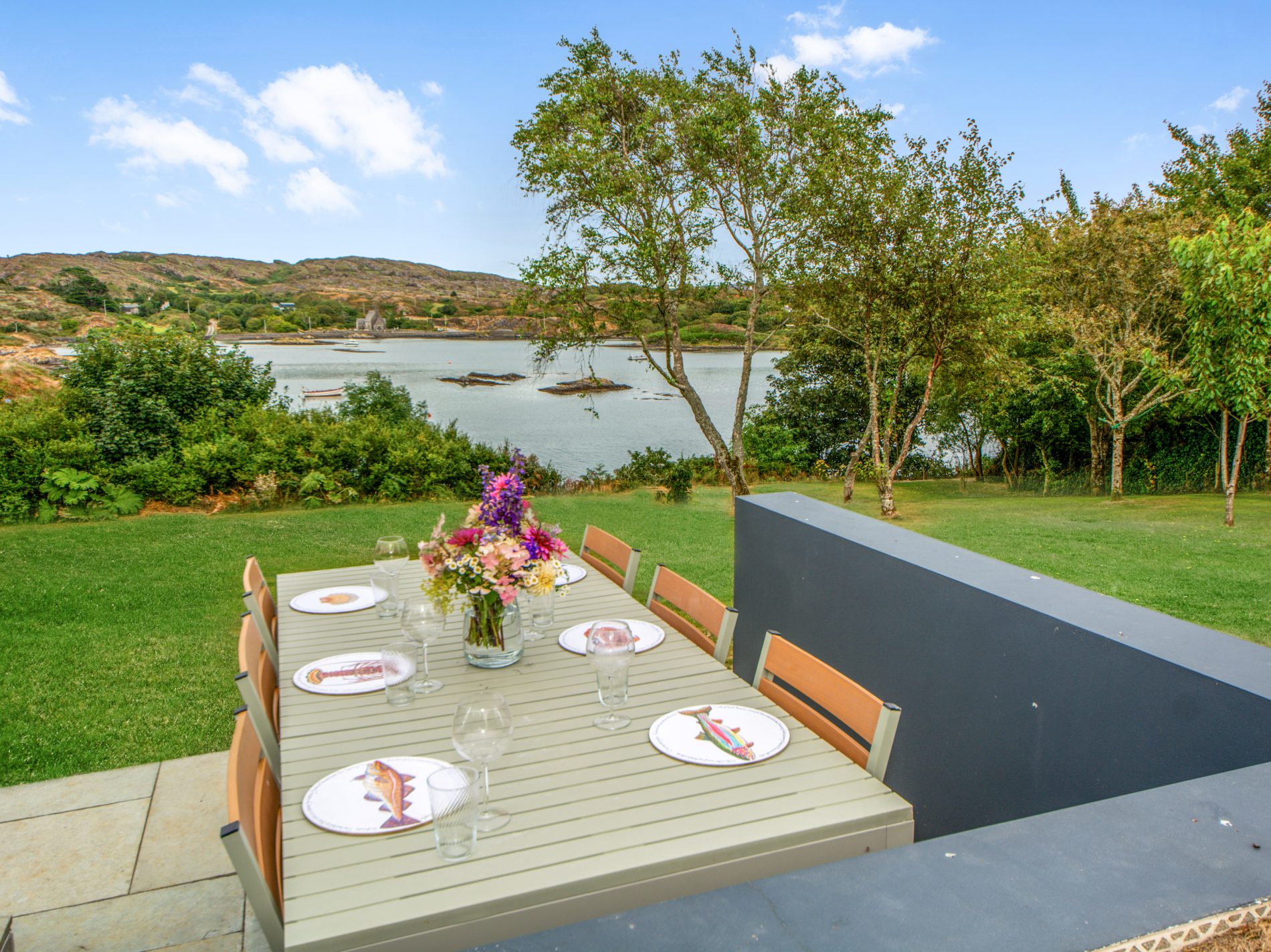 Outdoor dining terrace overlooking the cove